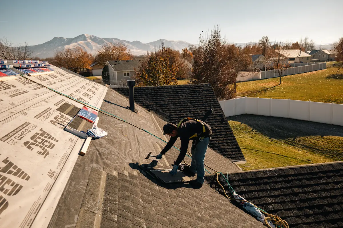 Homer Roofing crew installing GAF Timberline asphalt shingles on a Northern Utah home